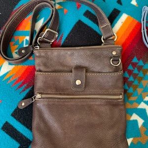 Roots Prince Leather dark brown Venetian crossbody bag.